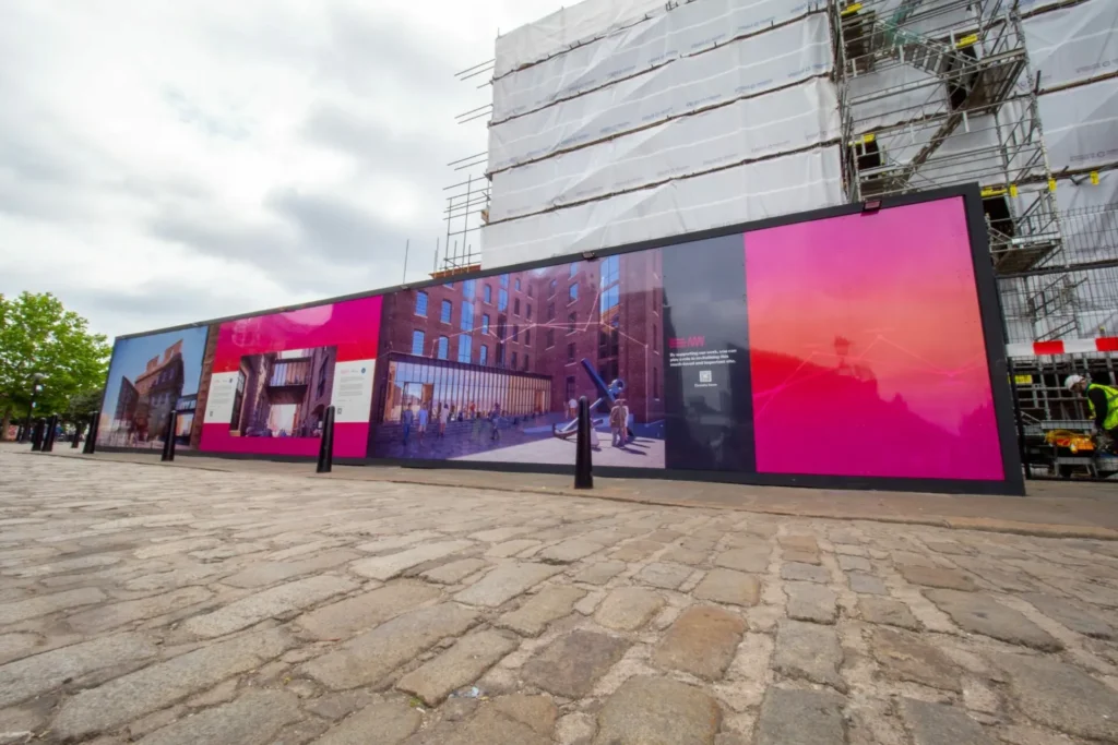 Leach provided large scale graphics displayed in front of the building that is being refurbished. The designs feature how the building will look like, the theme is pink, orange and black.