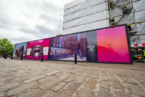 Leach provided large scale graphics displayed in front of the building that is being refurbished. The designs feature how the building will look like, the theme is pink, orange and black.