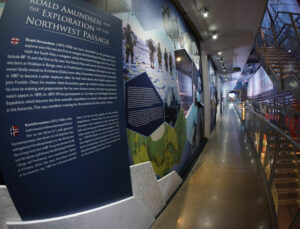 Navy background infographic about Roald Amundsen and the exploration of the northwest passage in exhibition at Fram museum