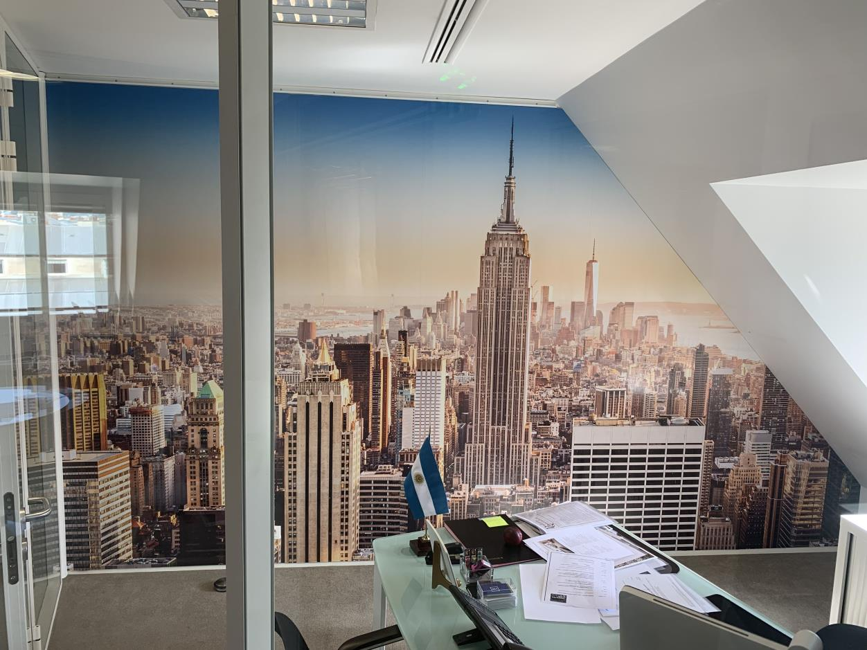 The office space with wallpaper featuring a city